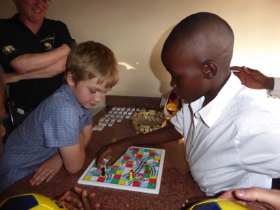 Alex and Gabriel engage in a game of snakes and ladders